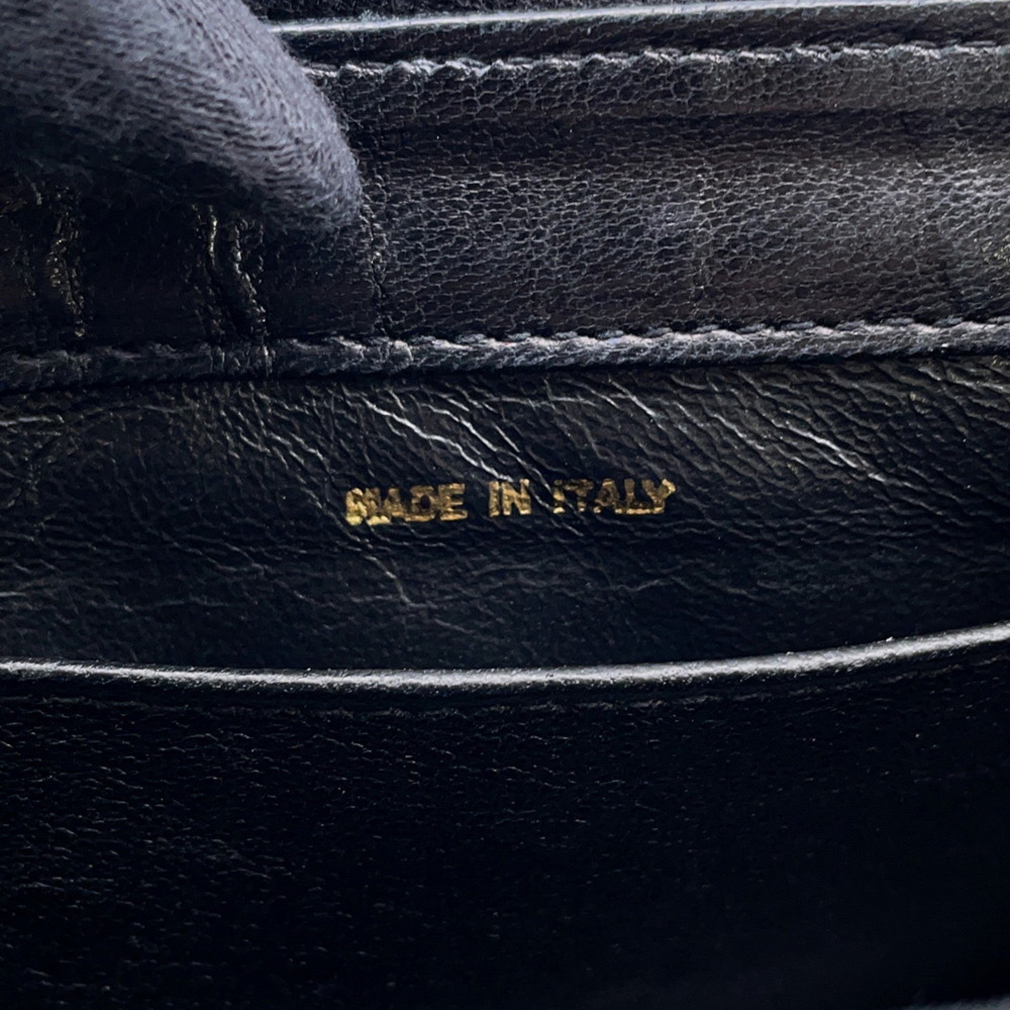 CHANEL Pre-Loved Matelasse Full Flap handbag interior showcasing made in Italy label on black leather