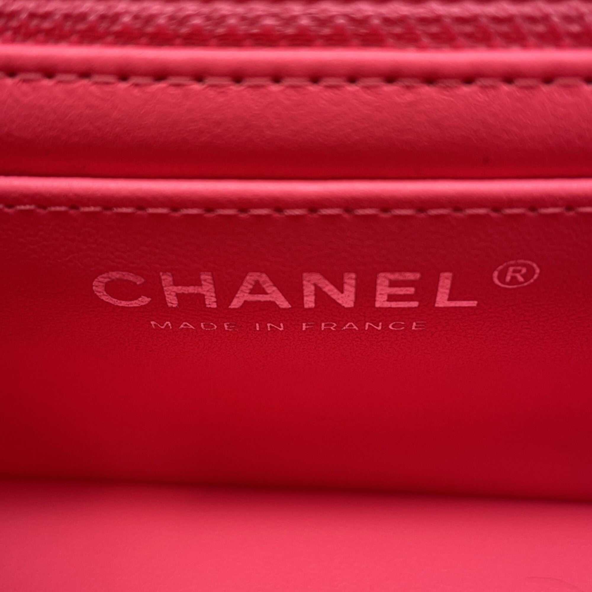 Inside view of CHANEL Pre-Loved Mini Matelasse 20 pink wallet with embossed logo detail
