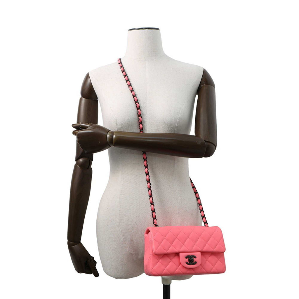 CHANEL Pre-Loved Mini Matelasse 20 pink handbag displayed on a mannequin with a chain strap