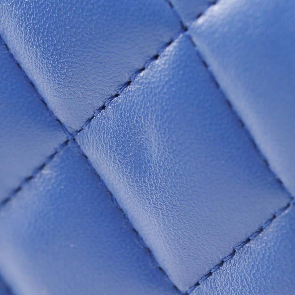 CHANEL pre-owned blue quilted leather bag showcasing detailed stitching and texture