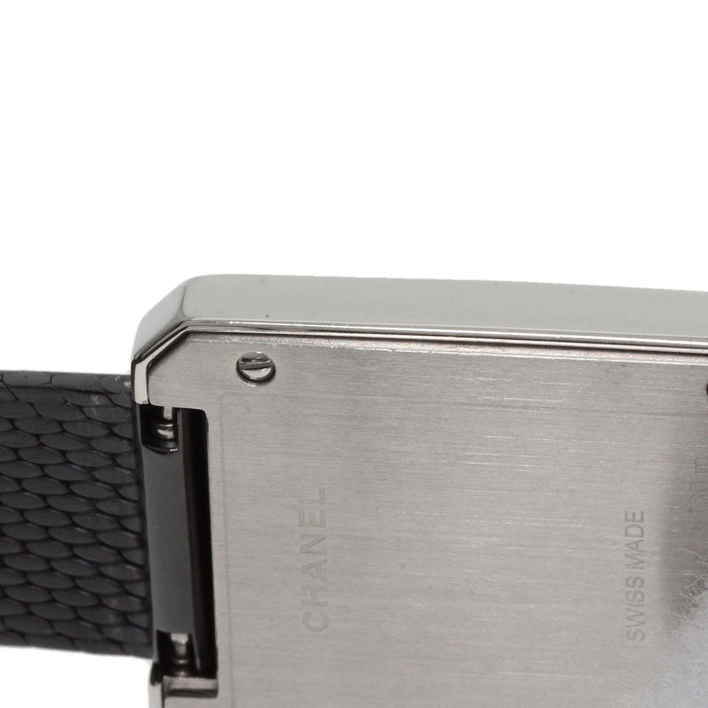 Close-up of pre-owned Chanel Boy-Friend watch with a sleek black mesh strap and polished silver case