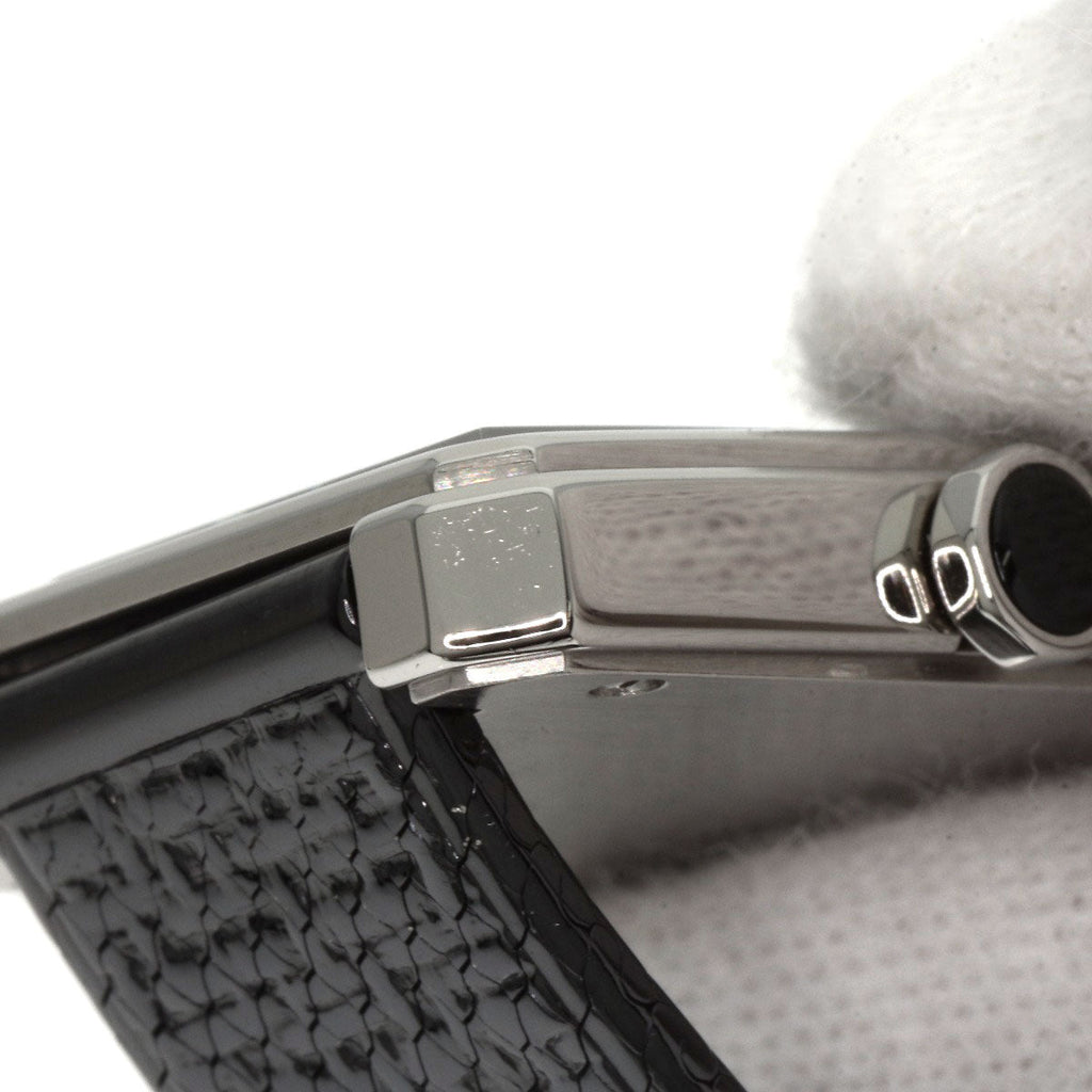 Close-up of pre-owned Chanel Boy-Friend watch showcasing its sleek design and black strap.