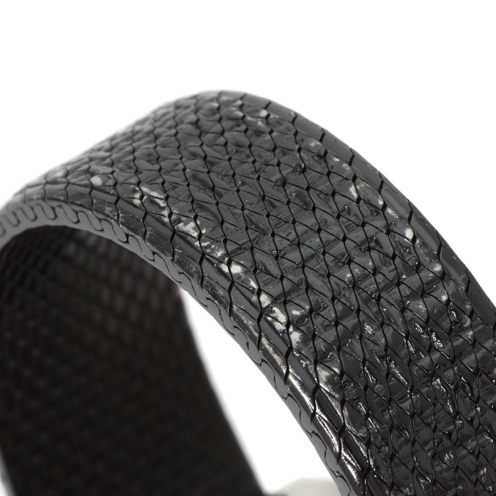 Close-up of pre-owned Chanel Boy-Friend watch with a textured black strap for stylish elegance