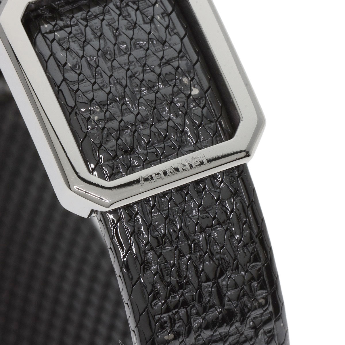 Close-up of the strap on a pre-owned Chanel Boy-Friend watch showcasing the textured black leather and silver hardware