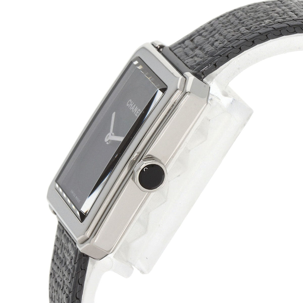 Elegant pre-owned Chanel Boy-Friend watch with a black strap and sleek rectangular face.