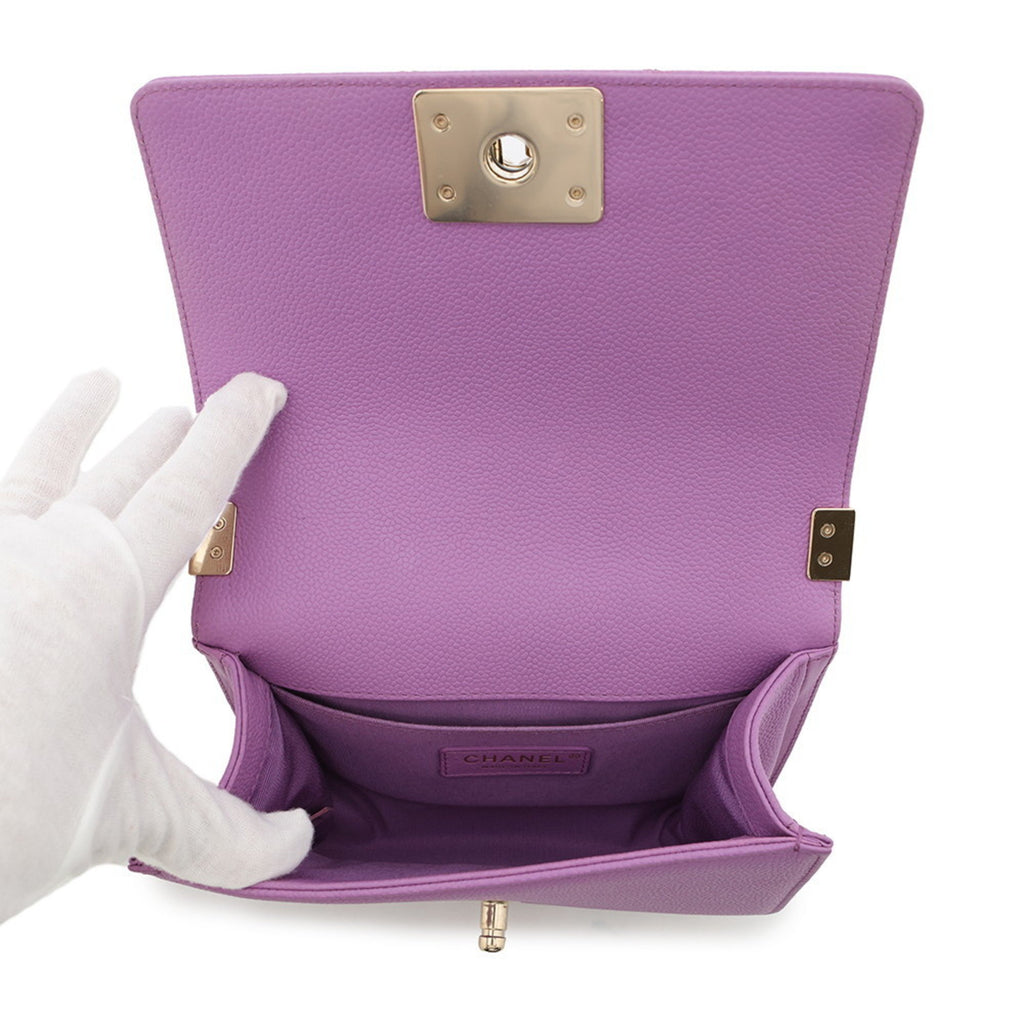 Inside view of a pre owned Chanel handbag in purple leather with multiple pockets