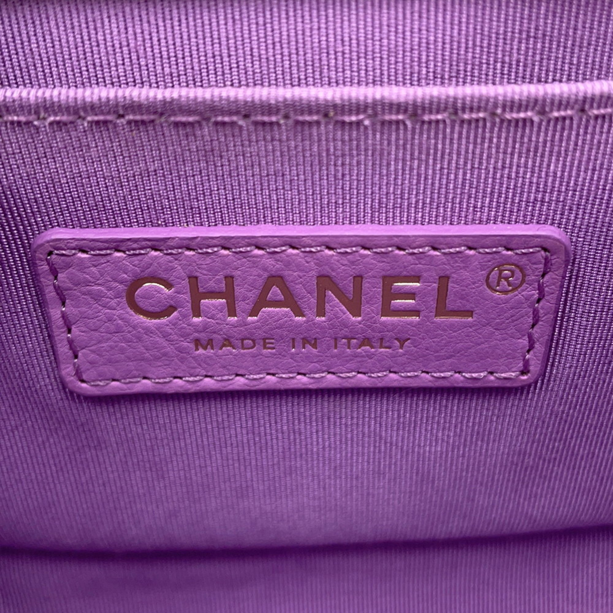 Chanel pre owned tag on a lavender bag made in Italy, showcasing luxury craftsmanship