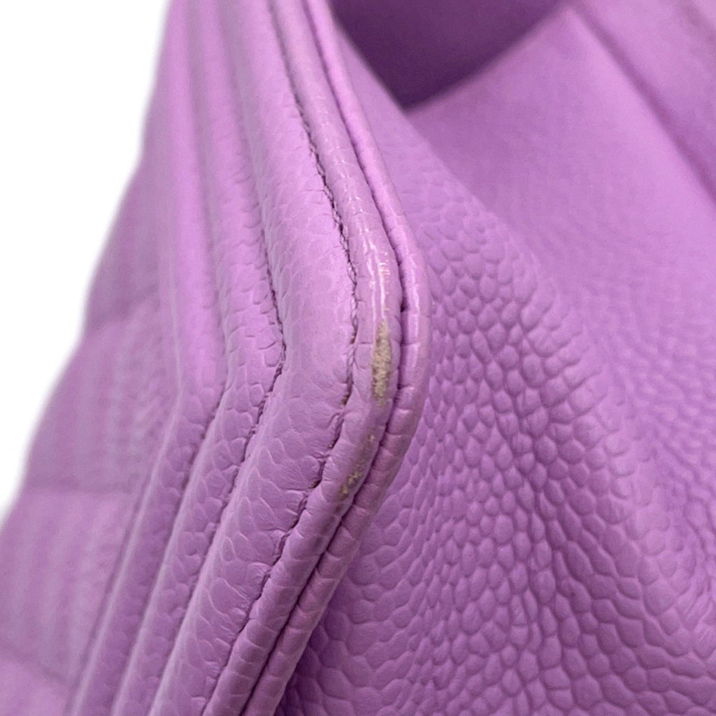 Chanel Pre owned pink quilted leather handbag with visible wear on the edge