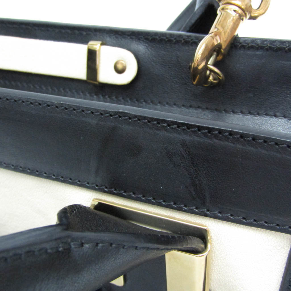 CHLOÉ Pre-Loved Little Alice bag showcasing a sleek design with black and cream accents
