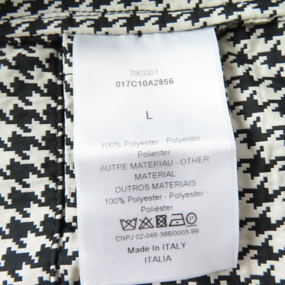 Tag of a Christian Dior pre-loved anorak made of 100% polyester, showcasing detailed care instructions