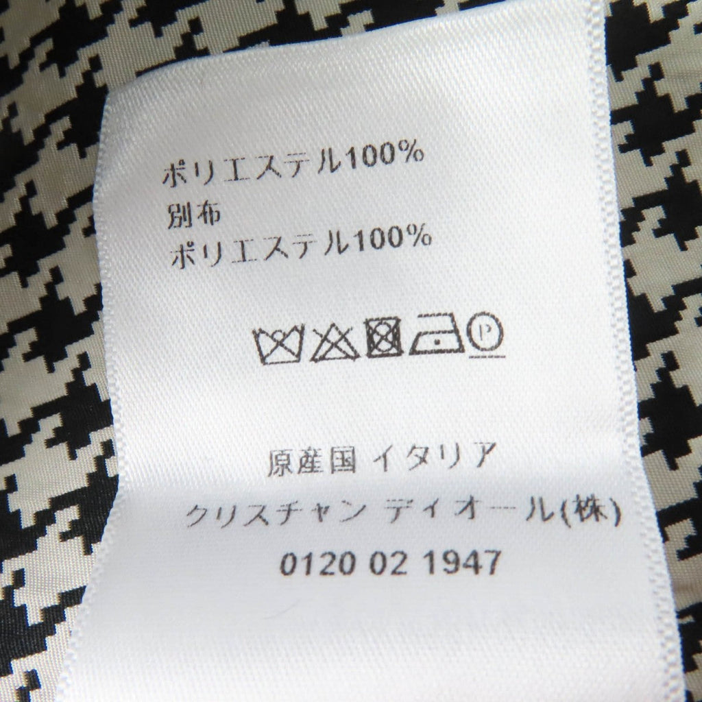 Label of Christian Dior pre-loved anorak showing fabric care instructions in Italian