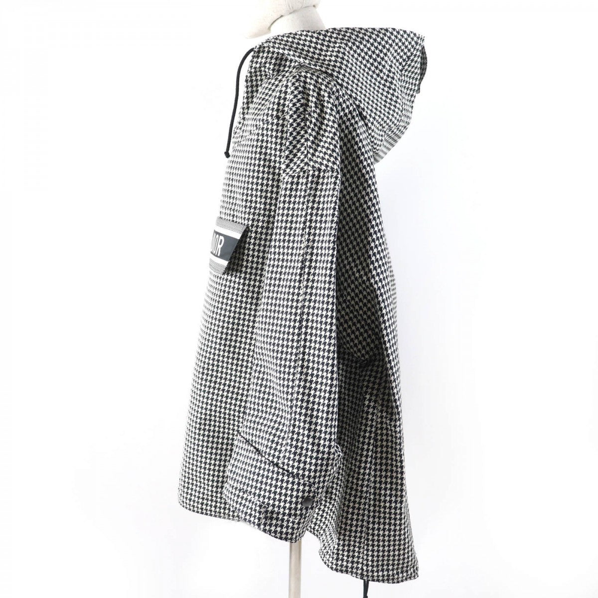 Christian Dior pre-loved anorak featuring a stylish checkered pattern and hood for a trendy look