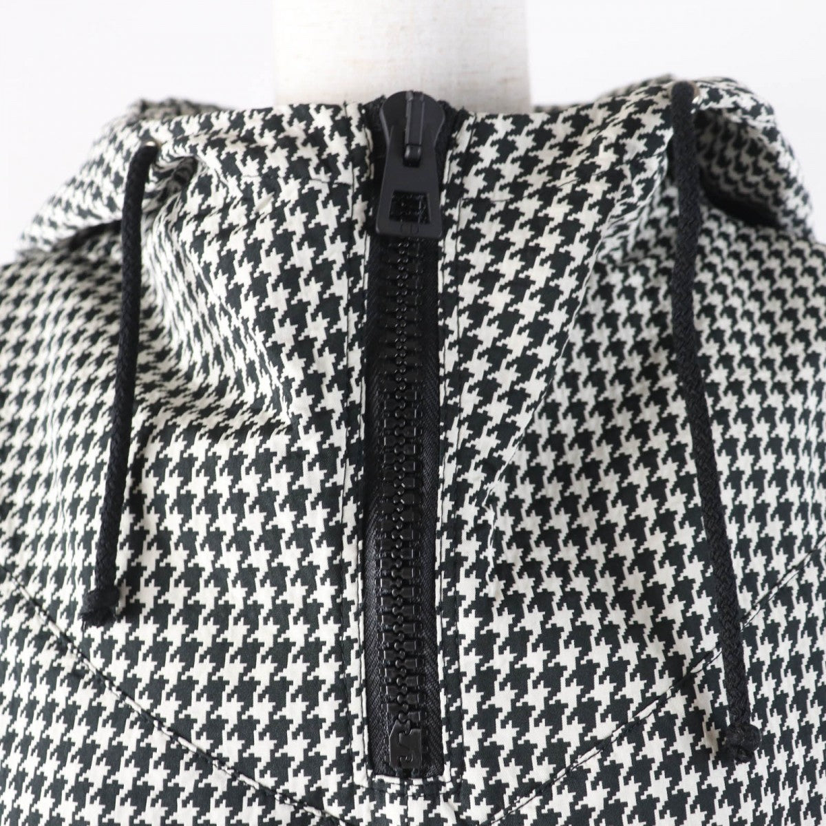 Christian Dior pre-loved anorak featuring a stylish houndstooth pattern and adjustable hood