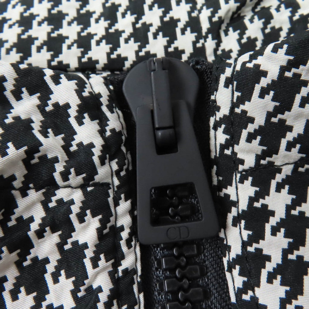 Close-up of the zipper detail on a Christian Dior pre-loved anorak in houndstooth pattern