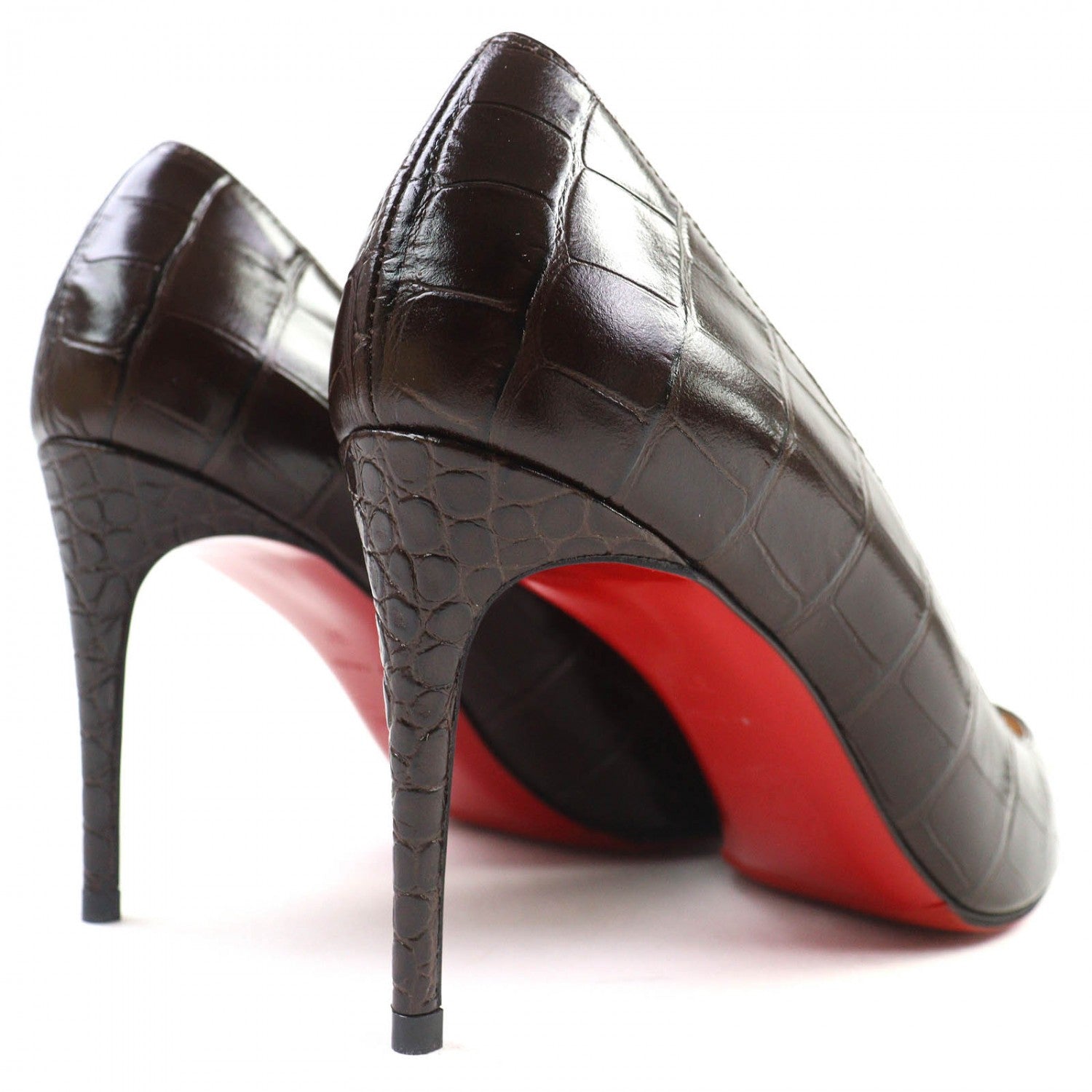 Elegant pre-owned Christian Louboutin pumps with a brown crocodile pattern and signature red soles