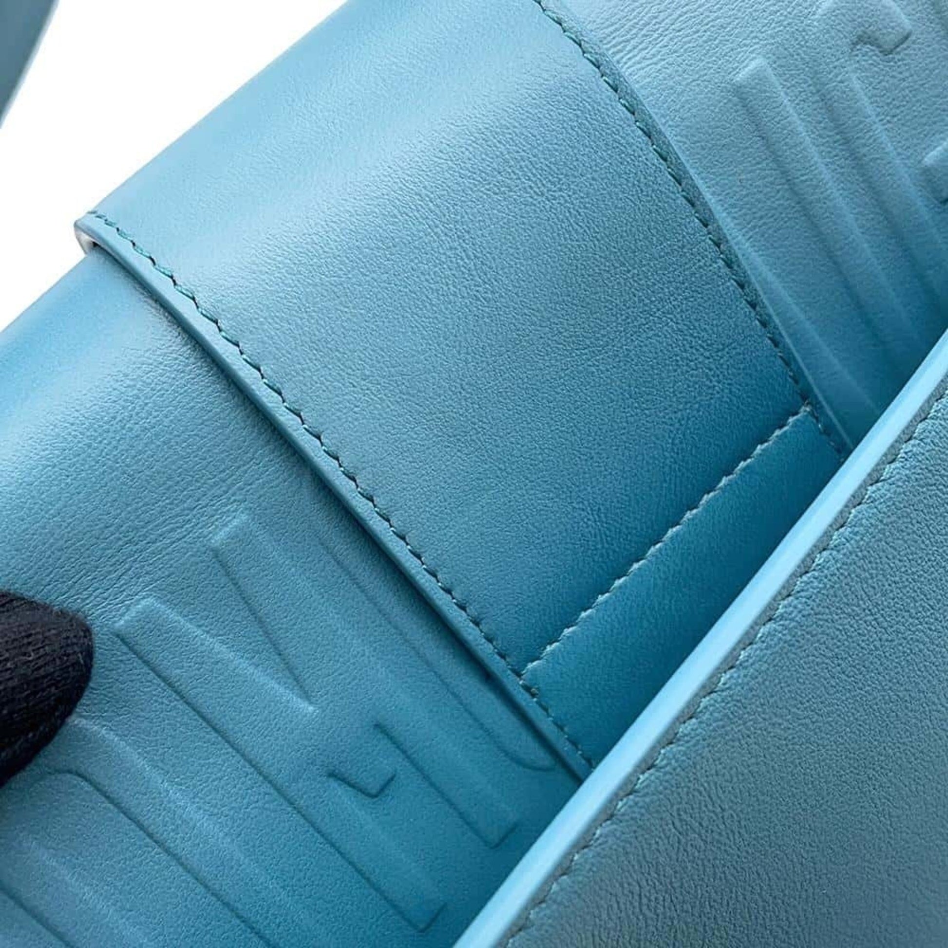 Christian Dior Pre-owned blue leather bag featuring embossed logo detailing and sleek design