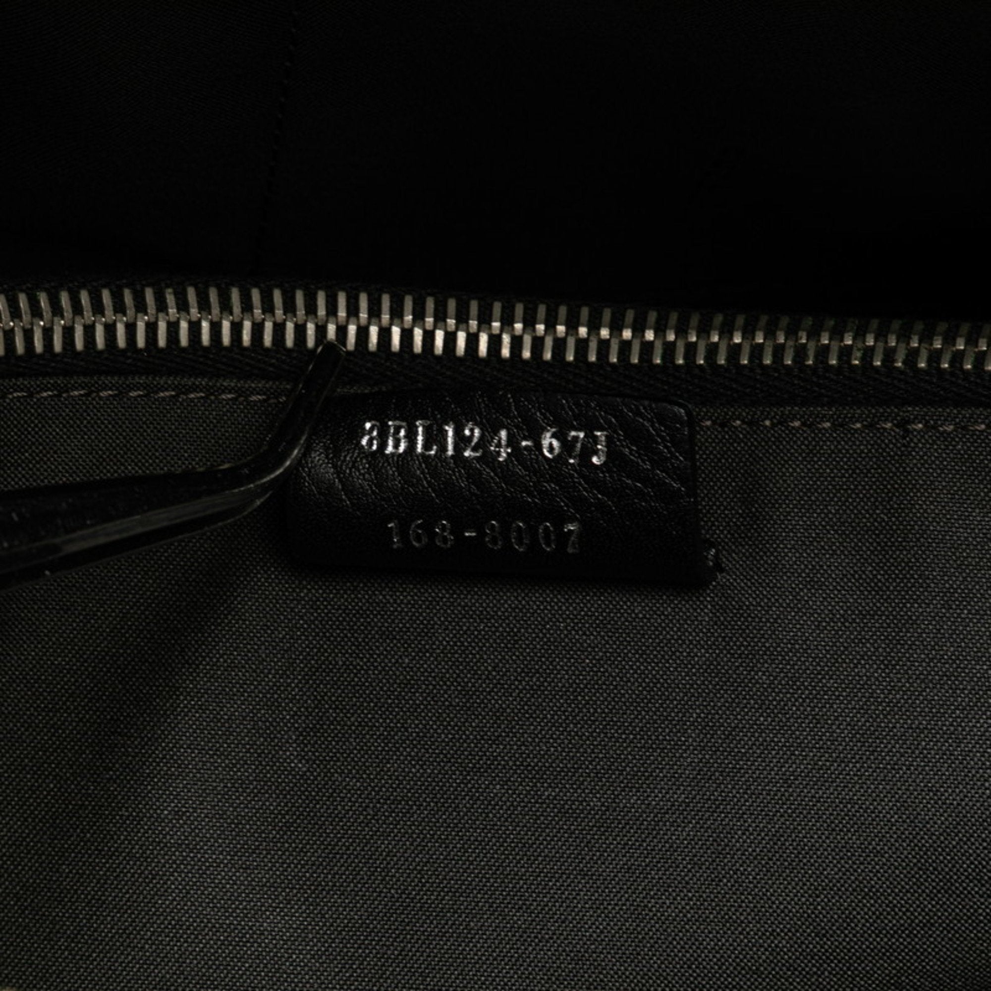 Interior view of a pre-owned Fendi By the Way bag showcasing the brand label and zipper detail