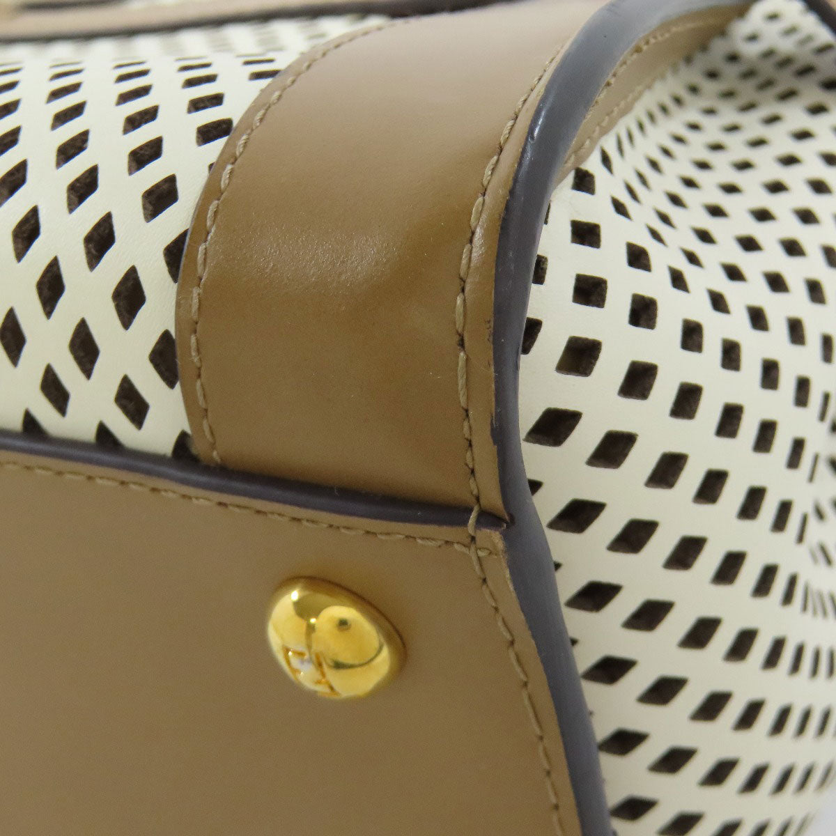 FENDI second hand bag featuring a unique perforated design and stylish gold hardware