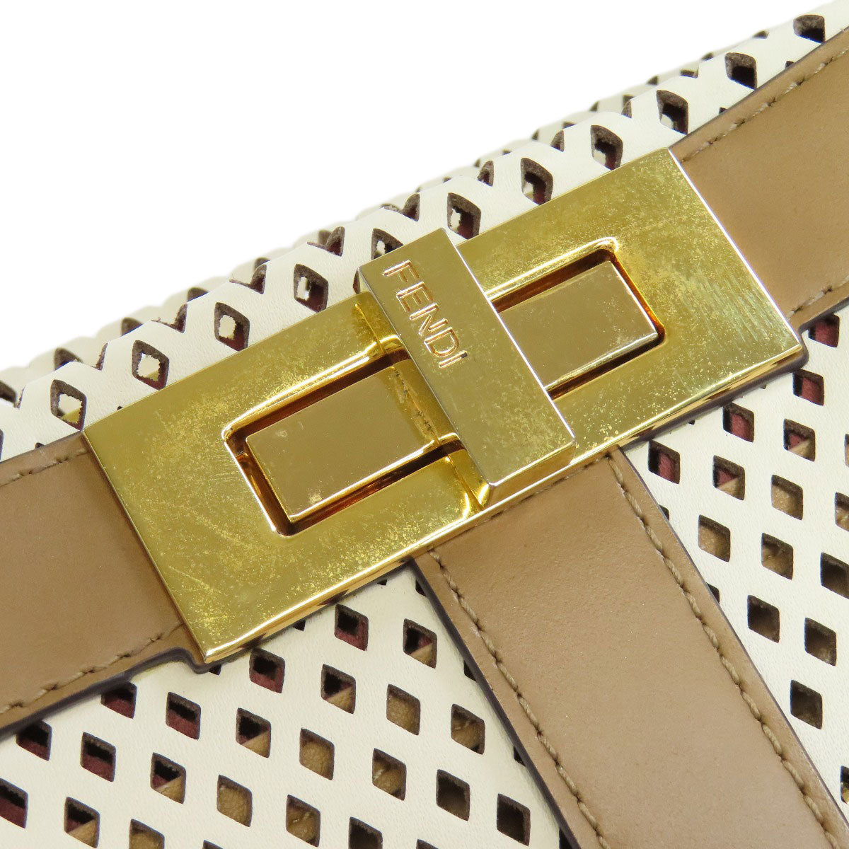 Fendi perforated bag with gold clasp, a stylish option for second hand luxury fashion