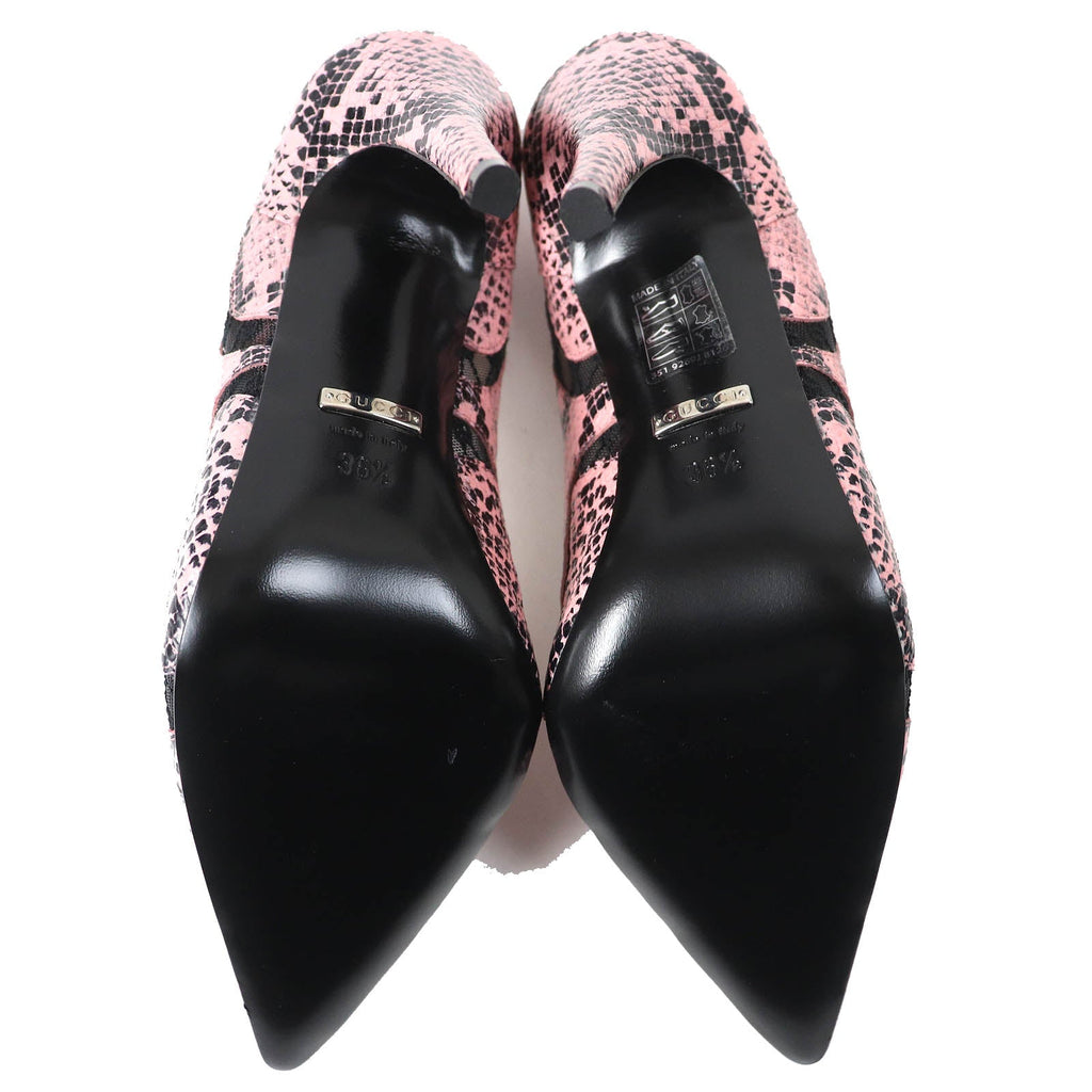 Gucci pink leather pumps featuring a stylish leopard print design with a pointed toe