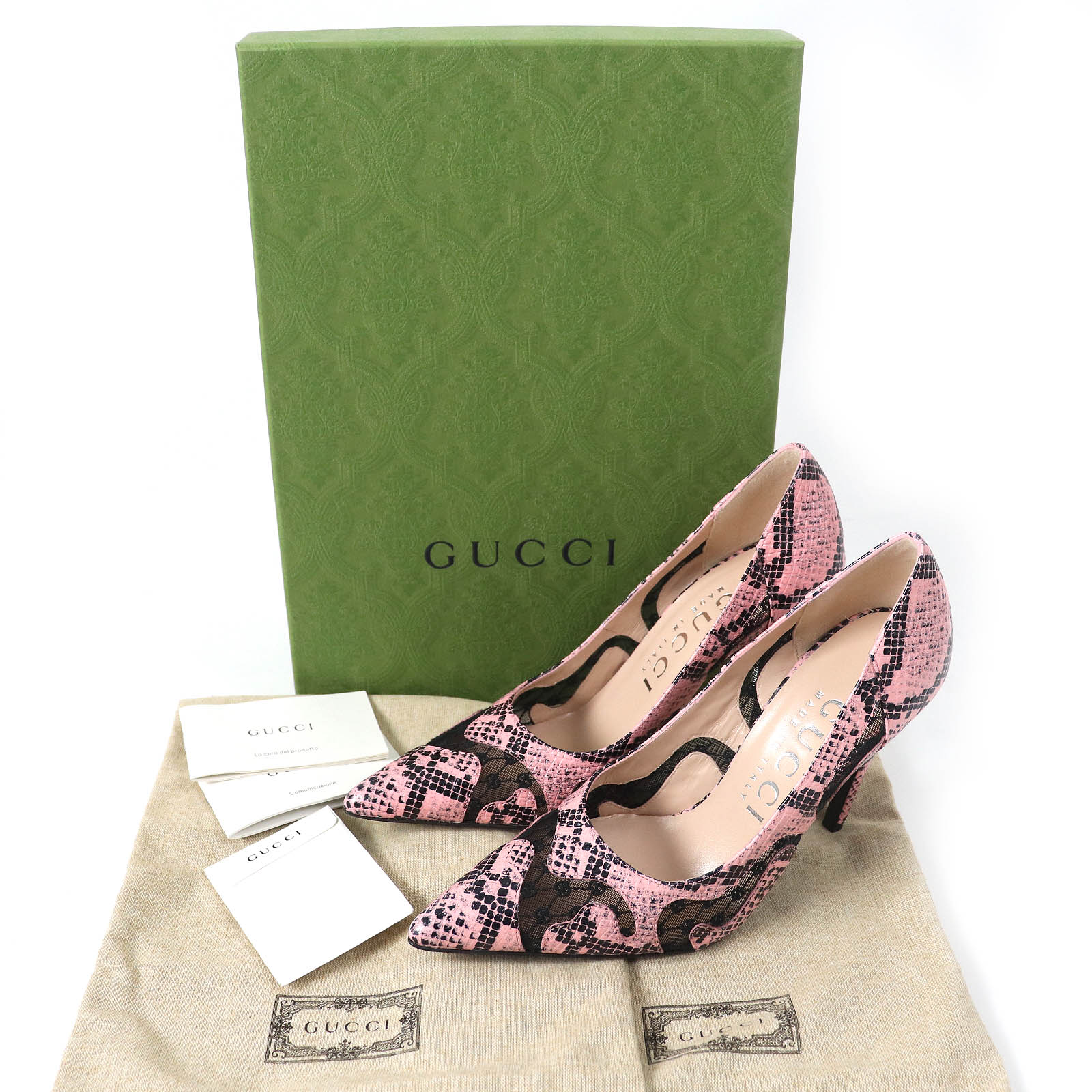 Gucci pink leather pumps with a stylish design, showcased with luxury packaging and care cards