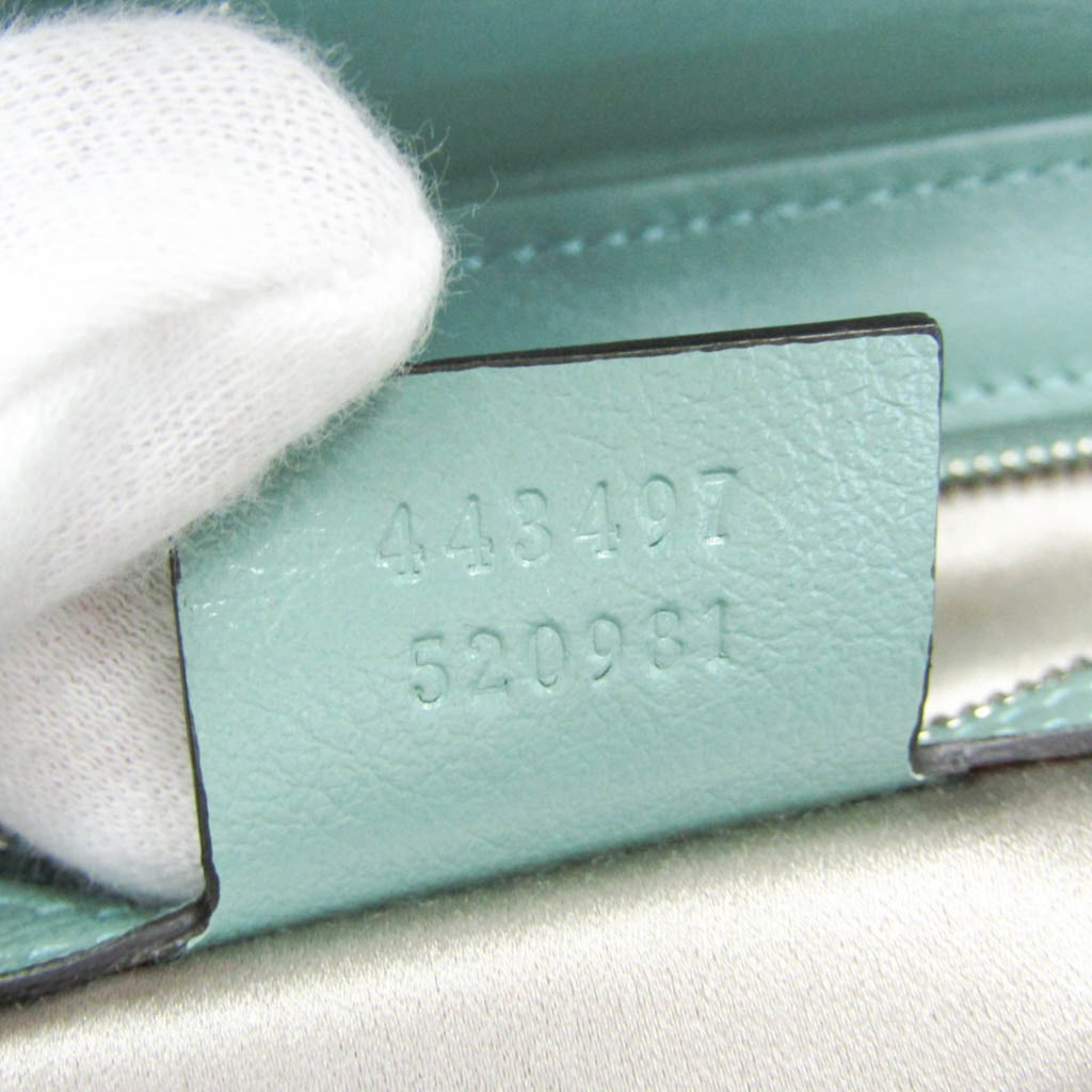 GUCCI Pre-Loved GG Marmont shoulder bag tag displaying serial numbers for authenticity