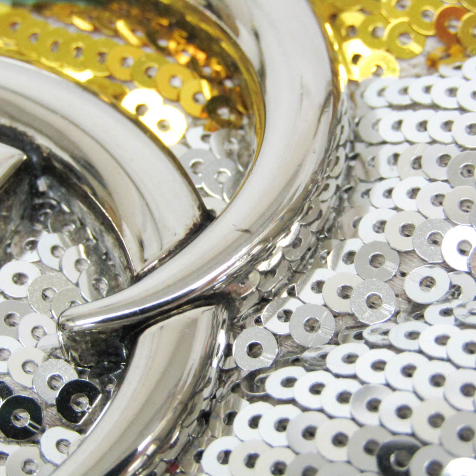 Close-up of GUCCI Pre-Loved GG Marmont shoulder bag with decorative sequins and metal hardware