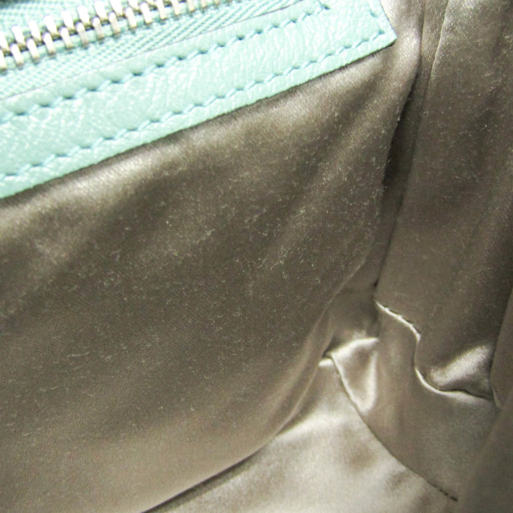 Interior view of GUCCI Pre-Loved GG Marmont shoulder bag featuring smooth satin lining