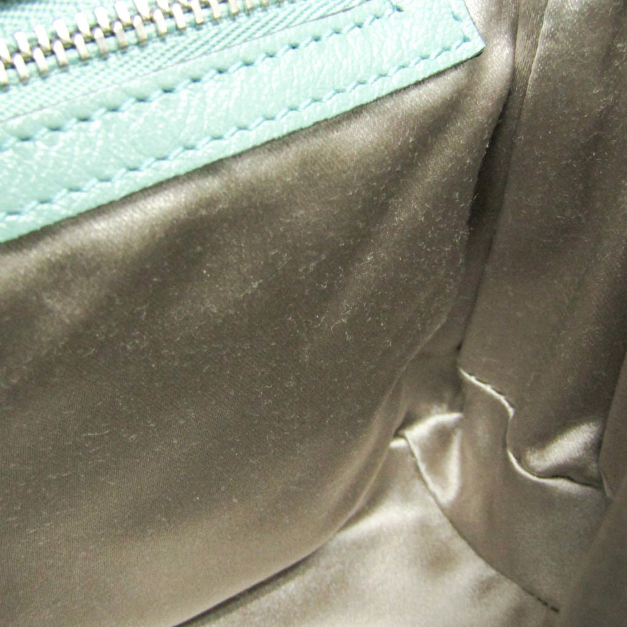 Interior view of GUCCI Pre-Loved GG Marmont shoulder bag featuring smooth satin lining