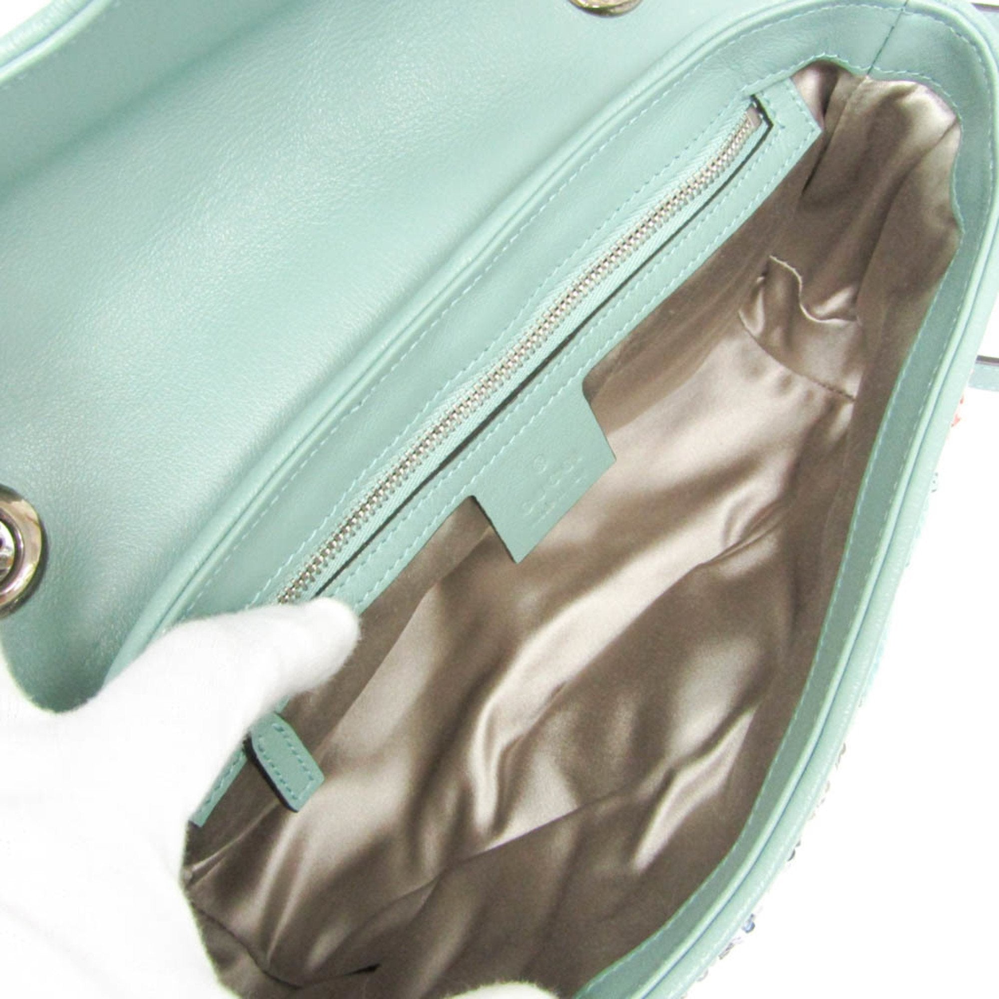 Interior view of GUCCI Pre-Loved GG Marmont shoulder bag featuring a spacious compartment with a soft lining