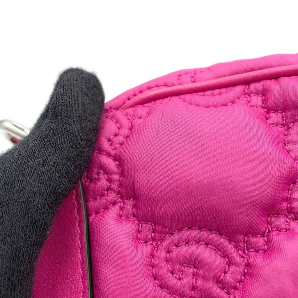 Close-up of MANSII GUCCI Pre-Loved GG Matelasse shoulder bag in vibrant pink with quilted detailing