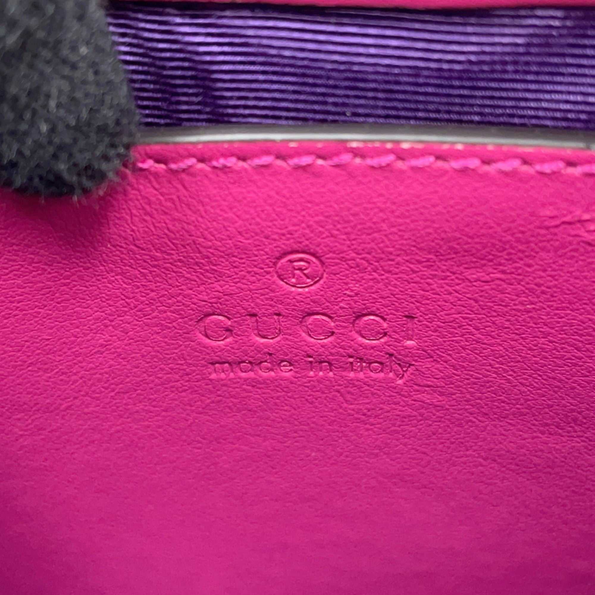 GUCCI Pre-Loved GG Matelasse shoulder bag interior with embossed logo in vibrant pink leather