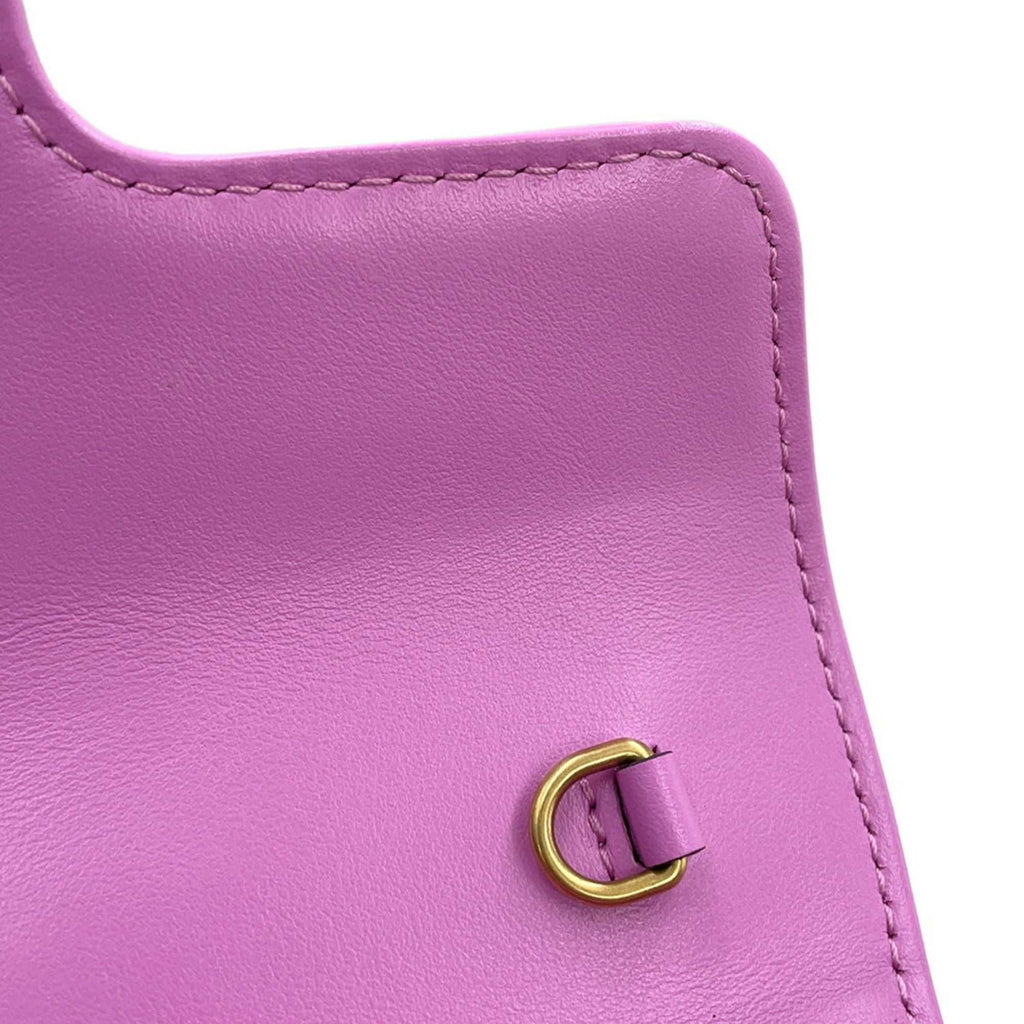 MANSII GUCCI Pre-Loved GG Super Mini Canvas bag in vibrant pink with gold hardware detailing