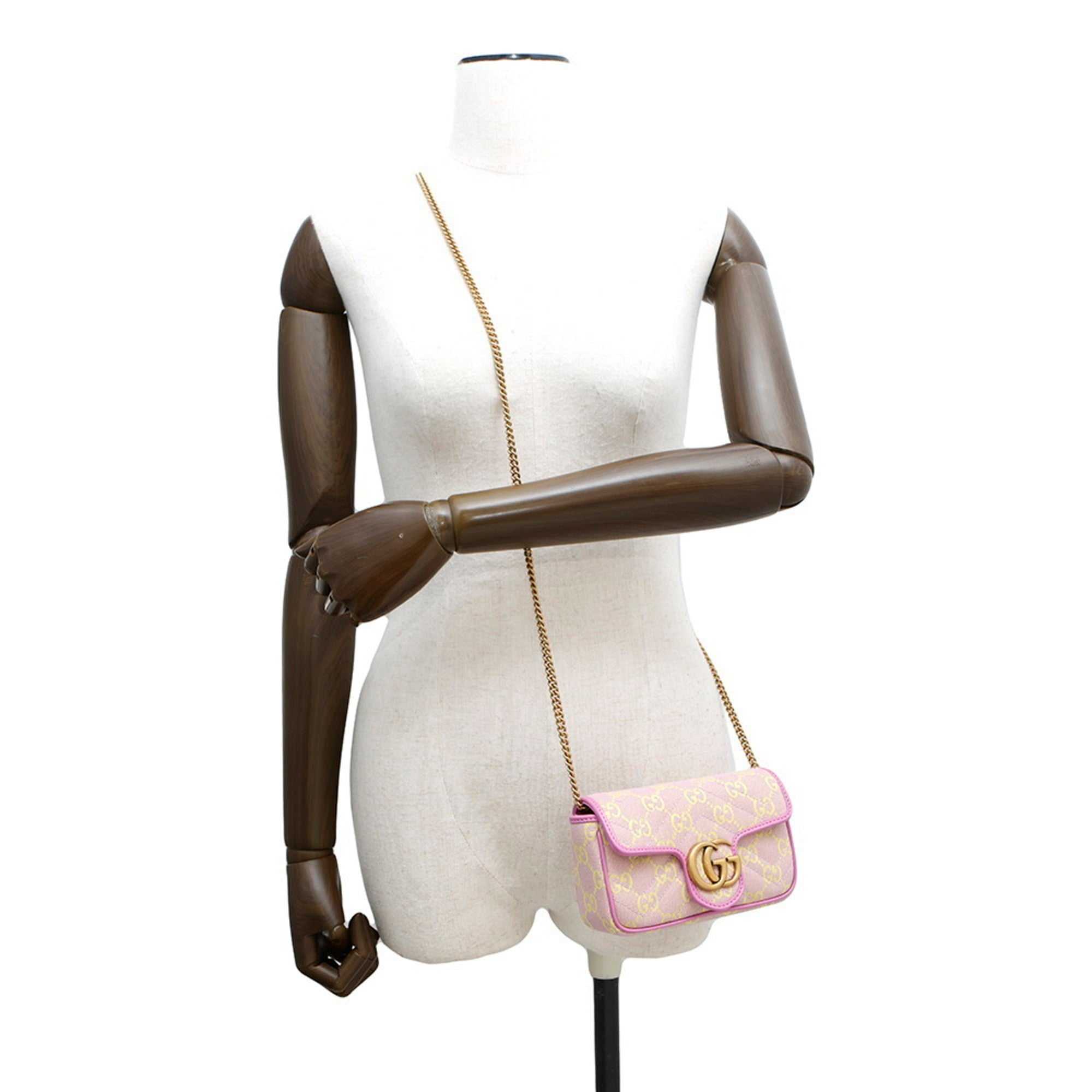 MANSII GUCCI Pre-Loved GG Super Mini Canvas bag on display with a stylish design and chain strap