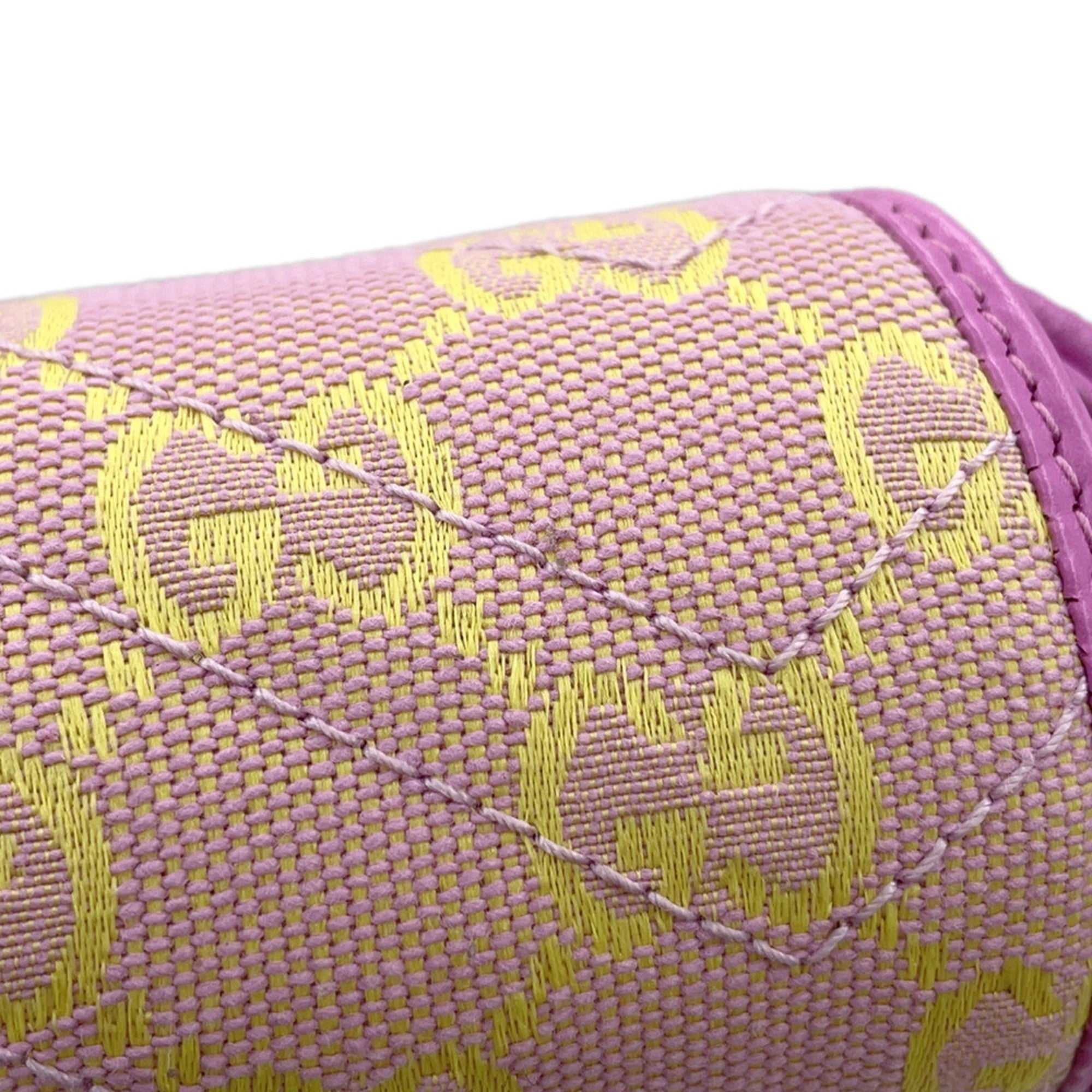 MANSII GUCCI Pre-Loved GG Super Mini Canvas bag in pink and yellow with iconic GG pattern