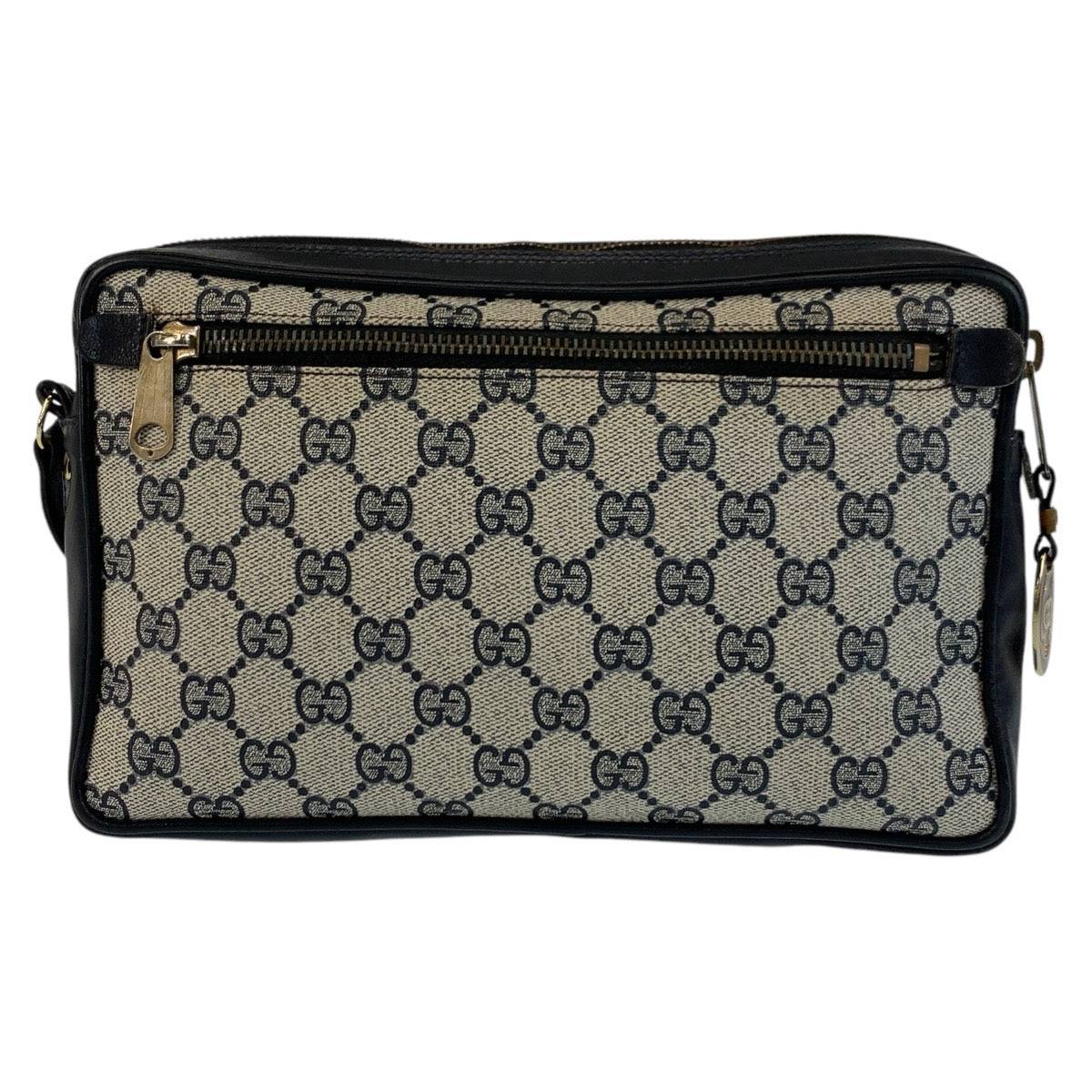 GUCCI pre-owned bag featuring signature logo design and stylish zippered compartments