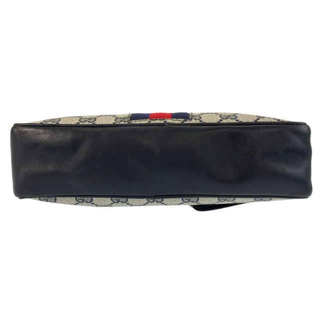 GUCCI pre-owned bag featuring signature canvas design and sleek leather base for stylish storage