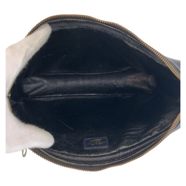 Interior view of a GUCCI pre-owned bag featuring dark lining and a spacious compartment