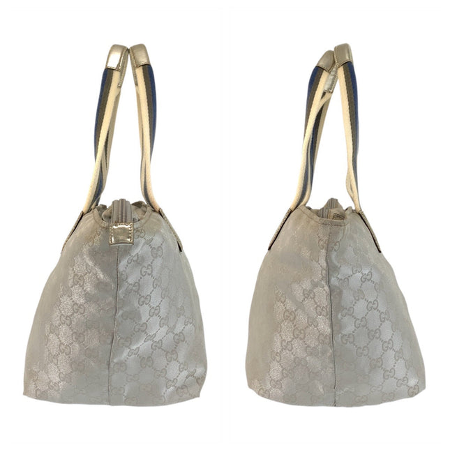 Pre-owned GUCCI handbag in beige with iconic logo pattern and elegant shoulder straps