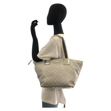 GUCCI pre-owned handbag in light beige with logo pattern and adjustable shoulder strap