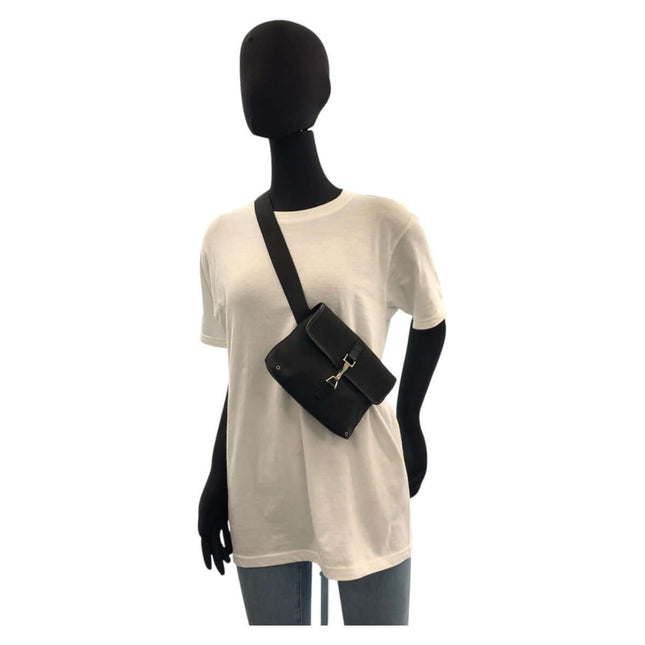 GUCCI pre-owned black crossbody bag displayed on a mannequin with a casual outfit