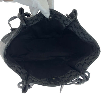 Inside view of a pre-owned GUCCI bag featuring a spacious interior with logo fabric lining