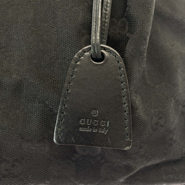 GUCCI pre-owned bag tag made in Italy with embossed logo detail on black fabric