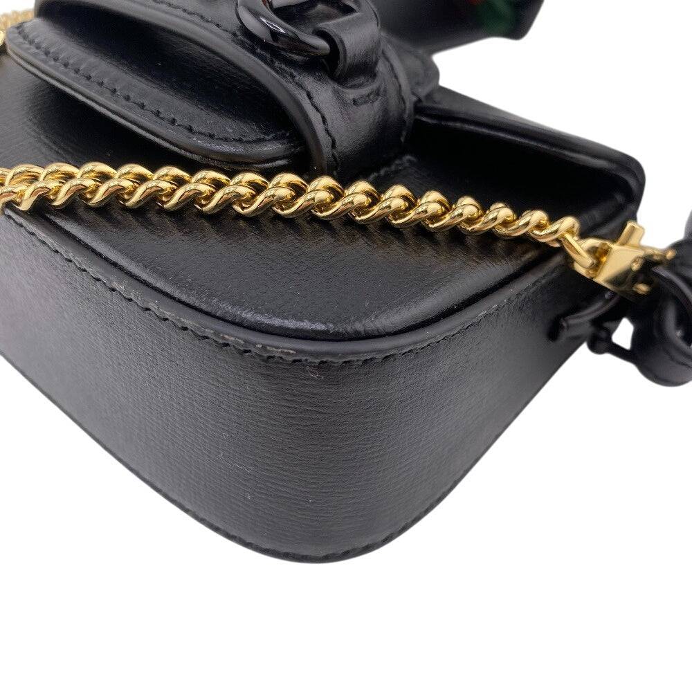 GUCCI pre-owned black leather bag with gold chain strap and elegant detailing