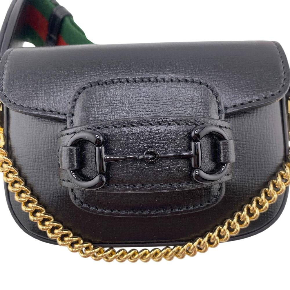 GUCCI pre-owned leather bag with a gold chain and distinctive buckle detail