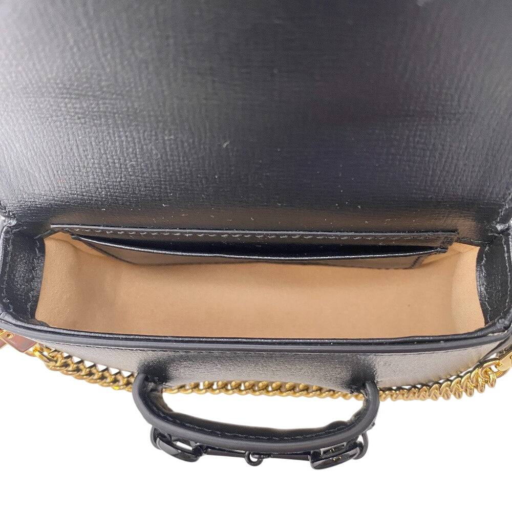Black GUCCI pre-owned bag with interior storage and chain strap detail