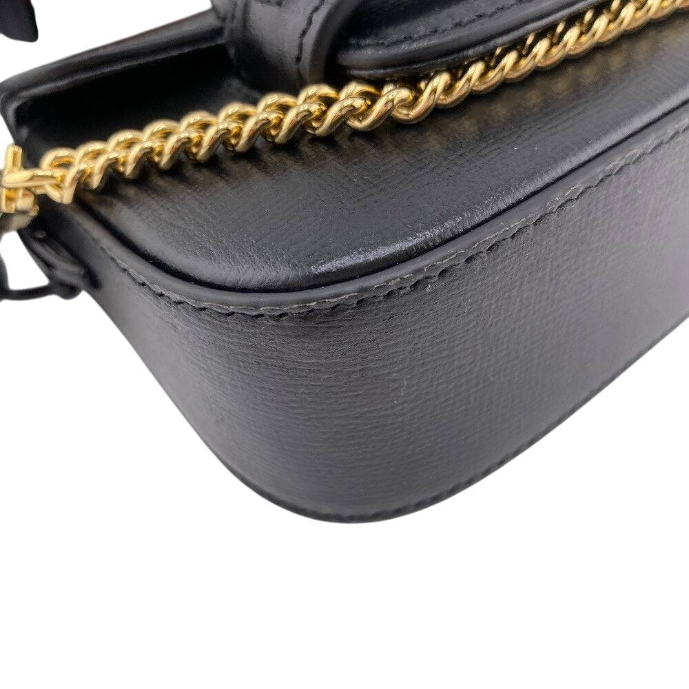 GUCCI pre-owned black leather bag with gold chain strap and sleek design for stylish outings