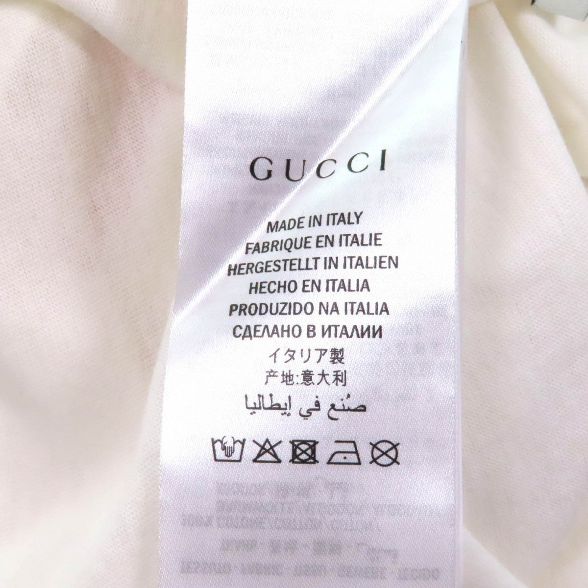 Pre-owned Gucci t-shirt featuring fabric label with care instructions, made in Italy tag