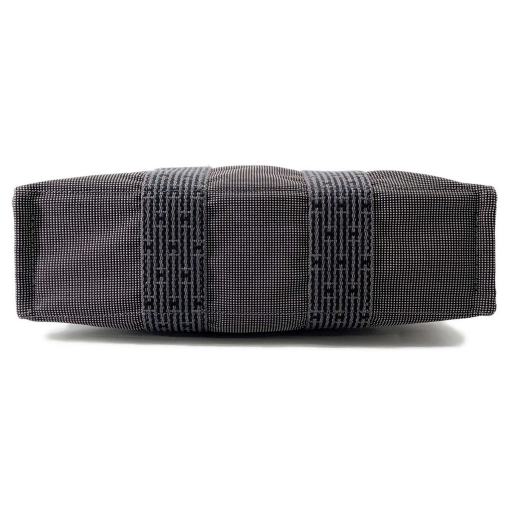 Hermès Pre-Loved Air Line PM Tote Bag with a stylish side view showcasing quality craftsmanship