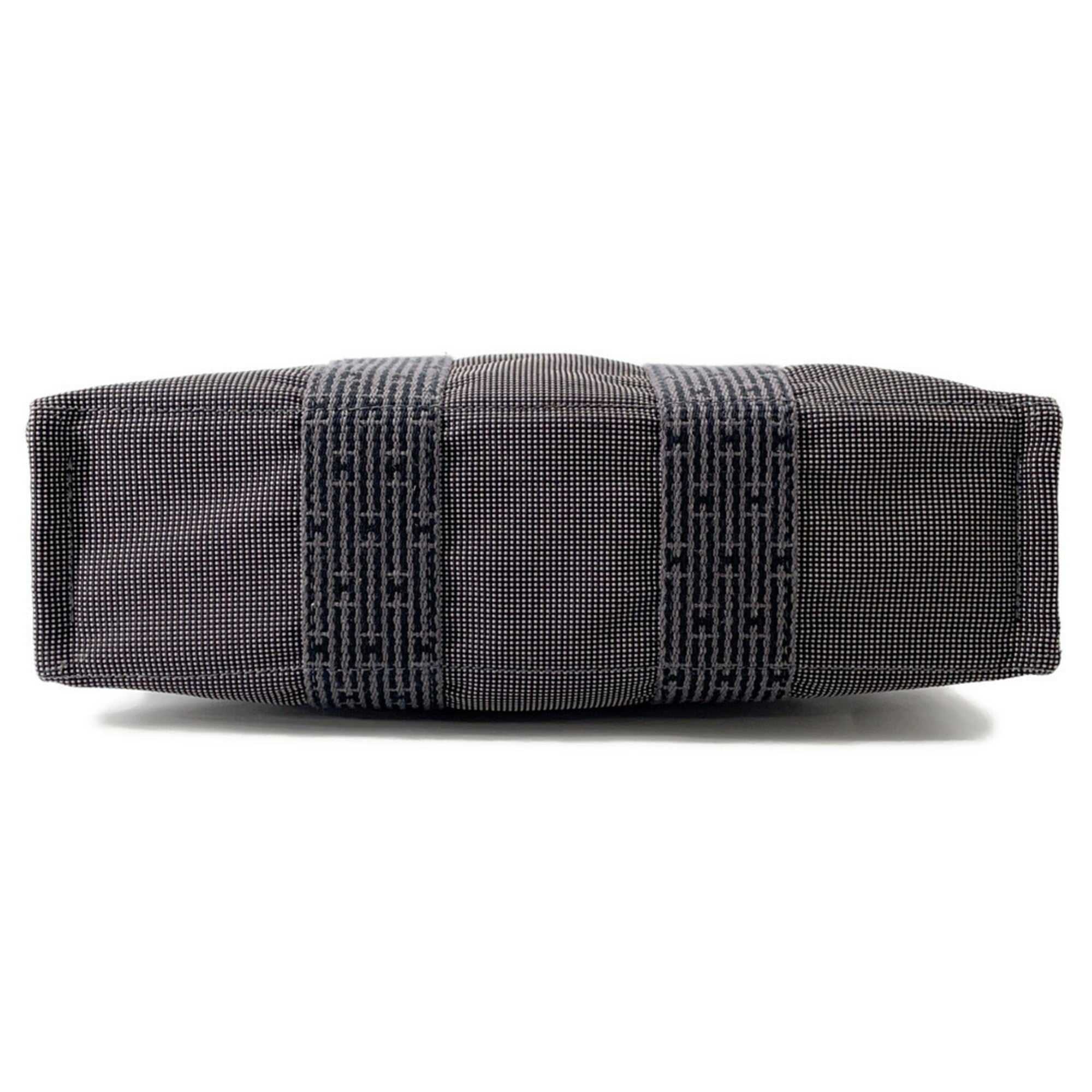 Hermès Pre-Loved Air Line PM Tote Bag with a stylish side view showcasing quality craftsmanship